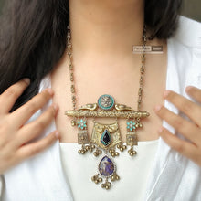 Load image into Gallery viewer, Sabya inspired turquoise German silver Purple Pachi Gold Tone ghungroo pendant set
