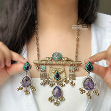 Load image into Gallery viewer, Sabya inspired turquoise German silver Purple Pachi Gold Tone ghungroo pendant set
