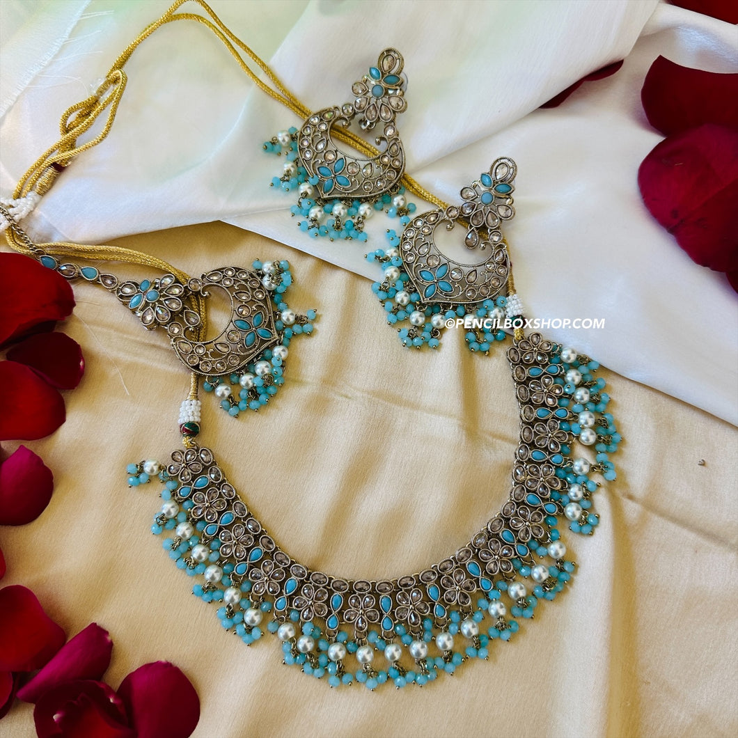 Aarohi Firozi Sky Blue Golden Polki Necklace Set with maangtikka