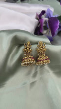 Load and play video in Gallery viewer, Ganpati Ruby Golden Kemp Stone Pearl drop Indian ethnic Jhumka earrings
