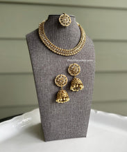 Load image into Gallery viewer, Golden polki Single line Neckline Necklace set with jhumkas and maangtikka
